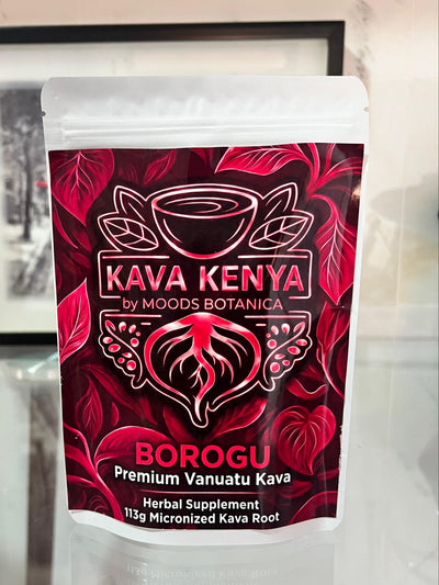 Kava Kenya Borogu packaging on a reflective surface with a blurred background