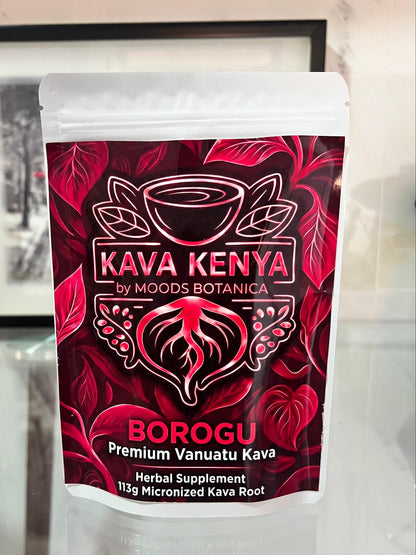 Kava Kenya Borogu packaging on a reflective surface with a blurred background