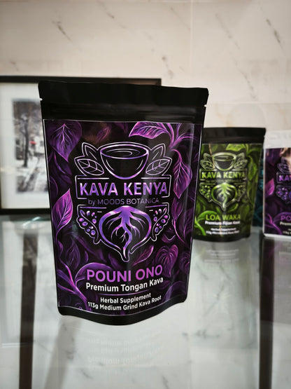 Pouni Ono Kava Kenya packaging on a marble surface with other Kava Kenya products in the background.